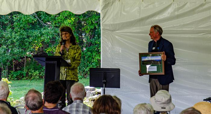 Sarah Thorne, wife of the late Tom Howe, accepted the award from President Jack Savage on stage at the annual meeting.