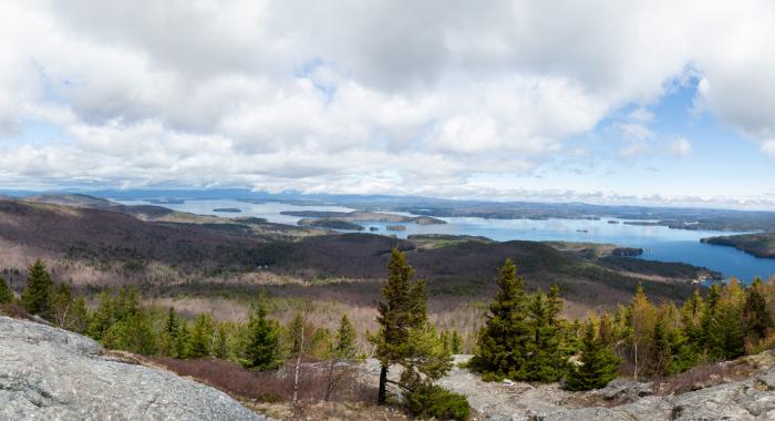 A panorama of Lake Winnipesaukee in the summer as seen from the top of Mount Major.