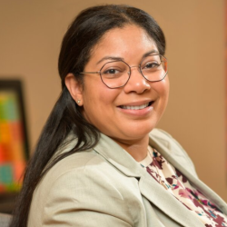 Elizabeth Salas Evans poses for a photo in her office.