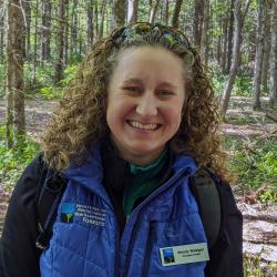 Wendy Weisiger pauses for a photo during a hike outside in the woods. (Photo: Ken Stern)