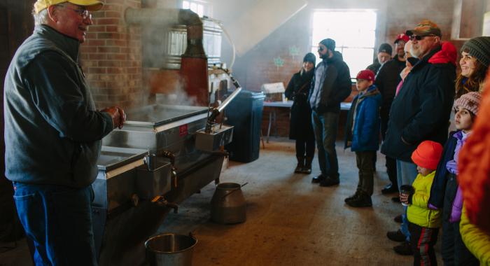 In the steamy sugarhouse, visitors hear from sugarmaker Brad Presby.