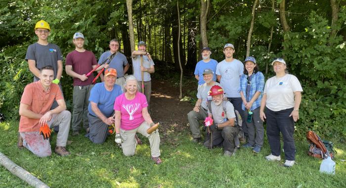 Volunteers and staff pose at Gipson Forest.