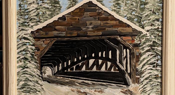 A covered bridge in winter.