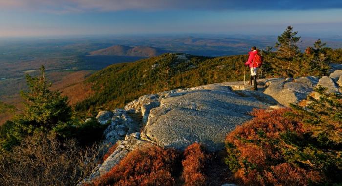 A hiker at the summit of Monadnock.