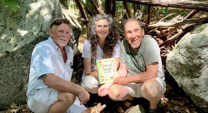 Dave Anderson, Susie Spikol and Chris Martin share a fairy structure.