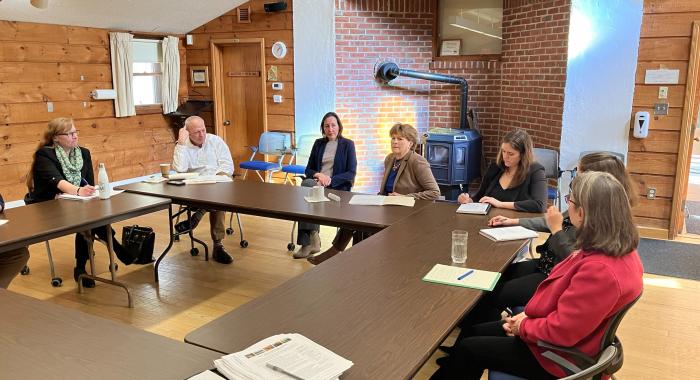 Senator Shaheen and leaders of local conservation groups are gathered at a table in the conference room.