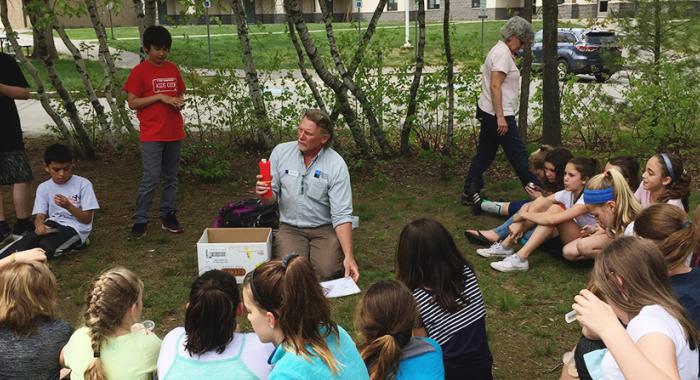 Hooksett 5th graders examine tree cookies and learn about tree identification