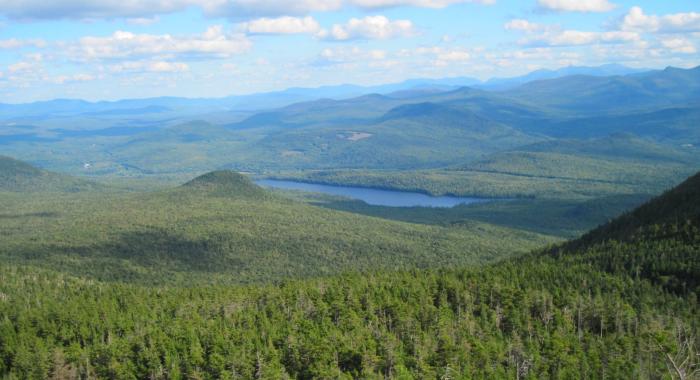 A view of mountain ridges overlooking a lake.