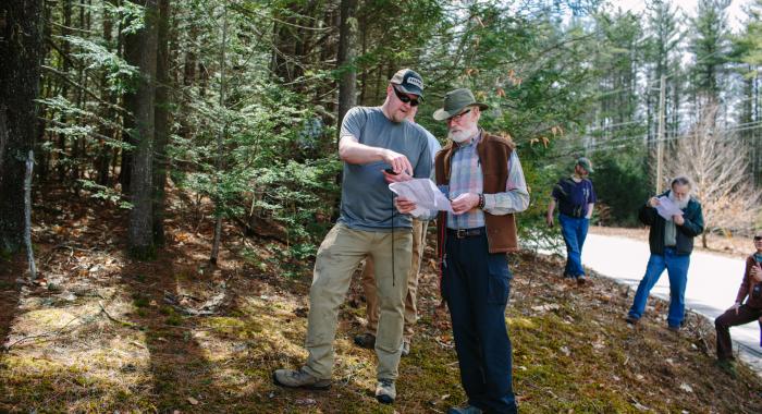 Outdoor conservation volunteers navigate property boundaries