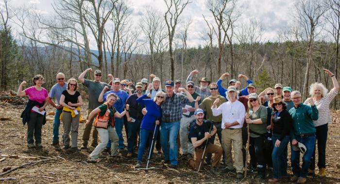 Land Steward volunteers flex their muscles during a walk on the Heald Tract in Wilton 