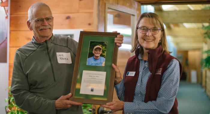 Lee Baker is awarded Volunteer of the Year by Forest Society president/forester Jane Difley