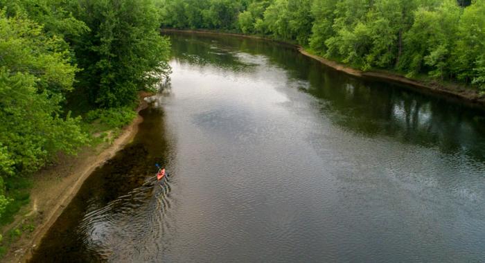 A kayaker paddles on the Merrimack River in Canterbury, New Hampshire
