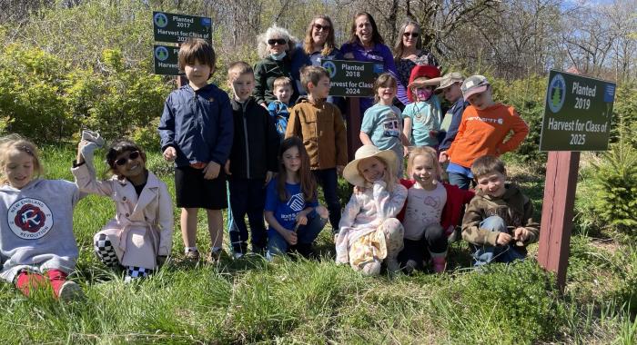 Bethlehem Elementary kindergarteners pose in the Forevergreen field where they planted their seedlings.