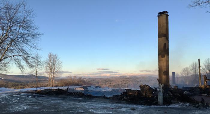 Only the chimney is left standing after a fire at the Rocks in Bethlehem New Hampshire