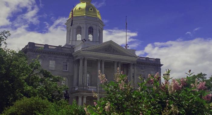 Lilacs bloom outside the State House.