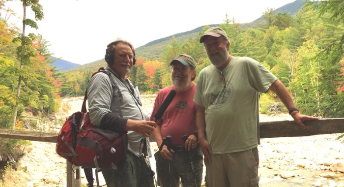 Dave Anderson, Mike Dickerman and Steve Smith pose on a bridge above the Pemigewassett Wilderness Trail at the Lincoln Woods Trailhead.