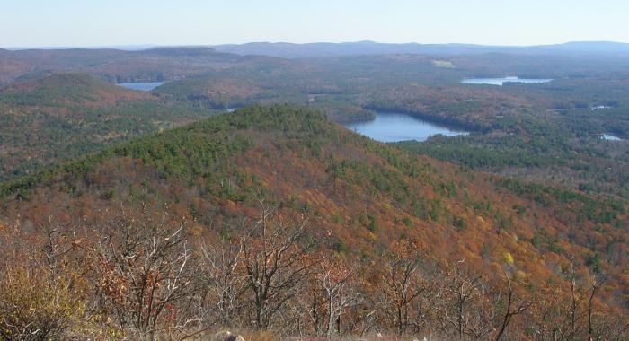 Water body view from summit of mountain in spring blue sky background