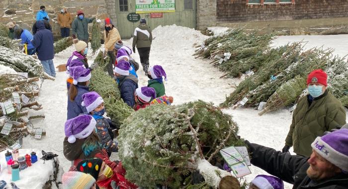 Bethlehem Elementary fifth-graders help load the trees into a FedEx truck.
