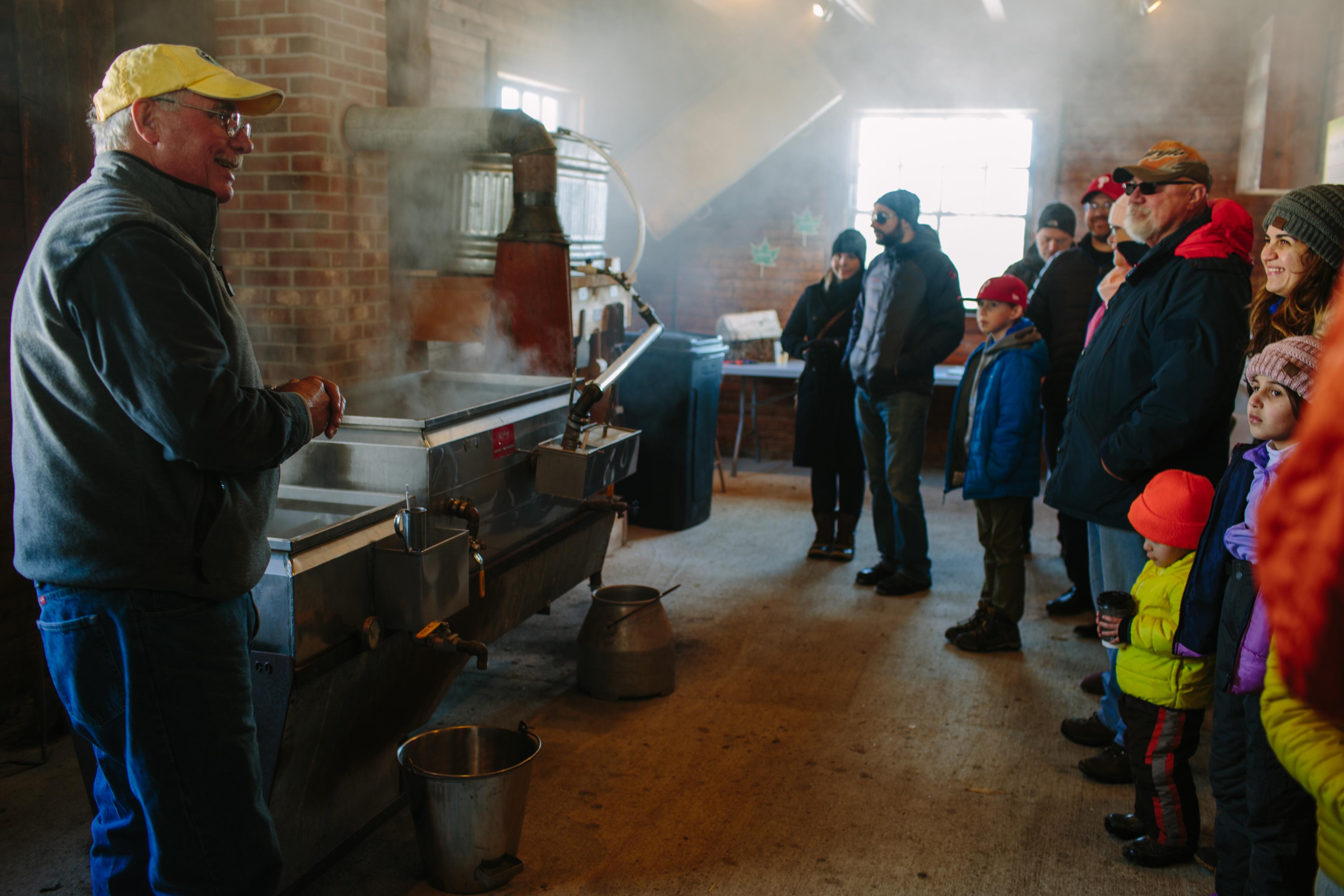 In the steamy sugarhouse, visitors hear from sugarmaker Brad Presby.
