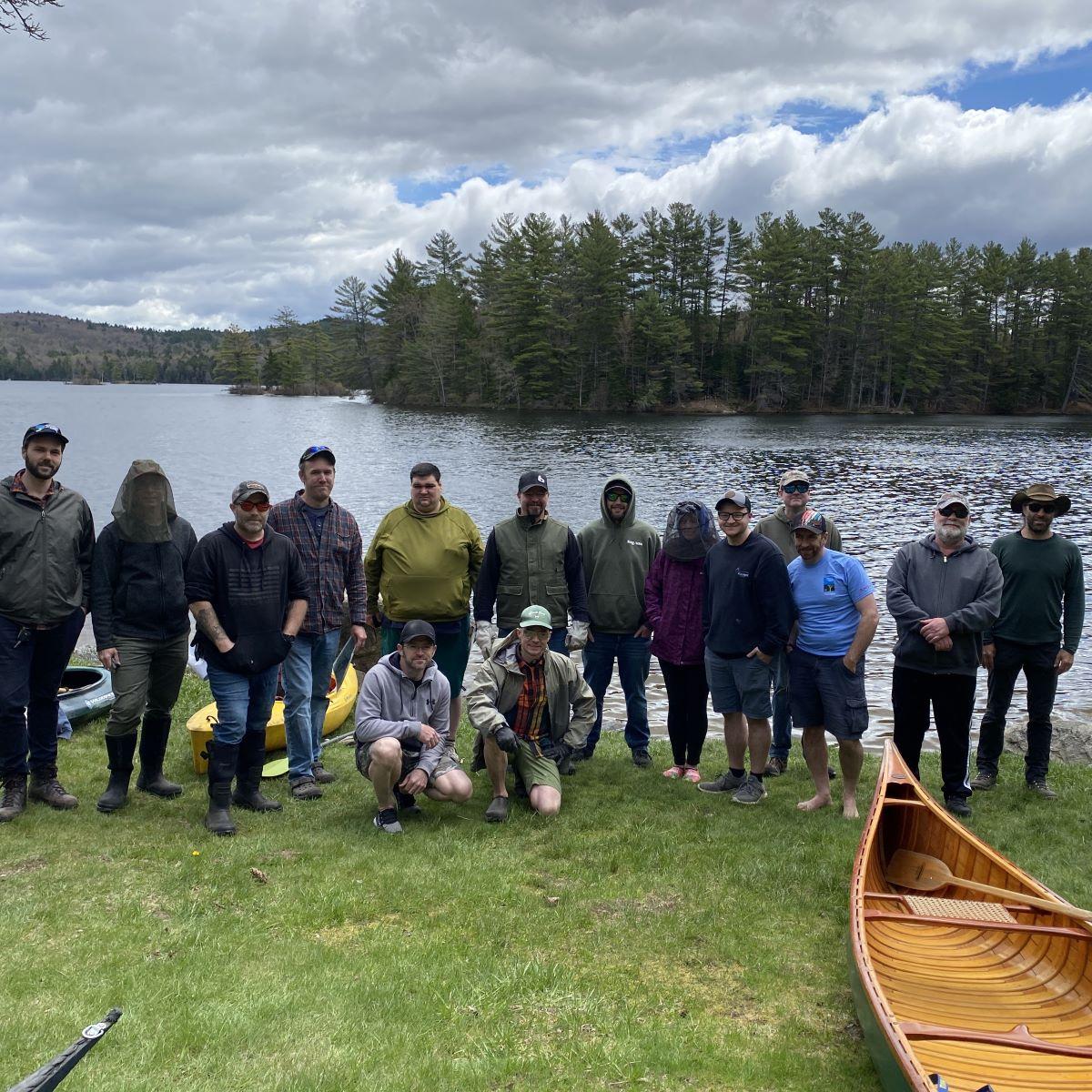 Hypertherm employees pose by Grafton Pond.