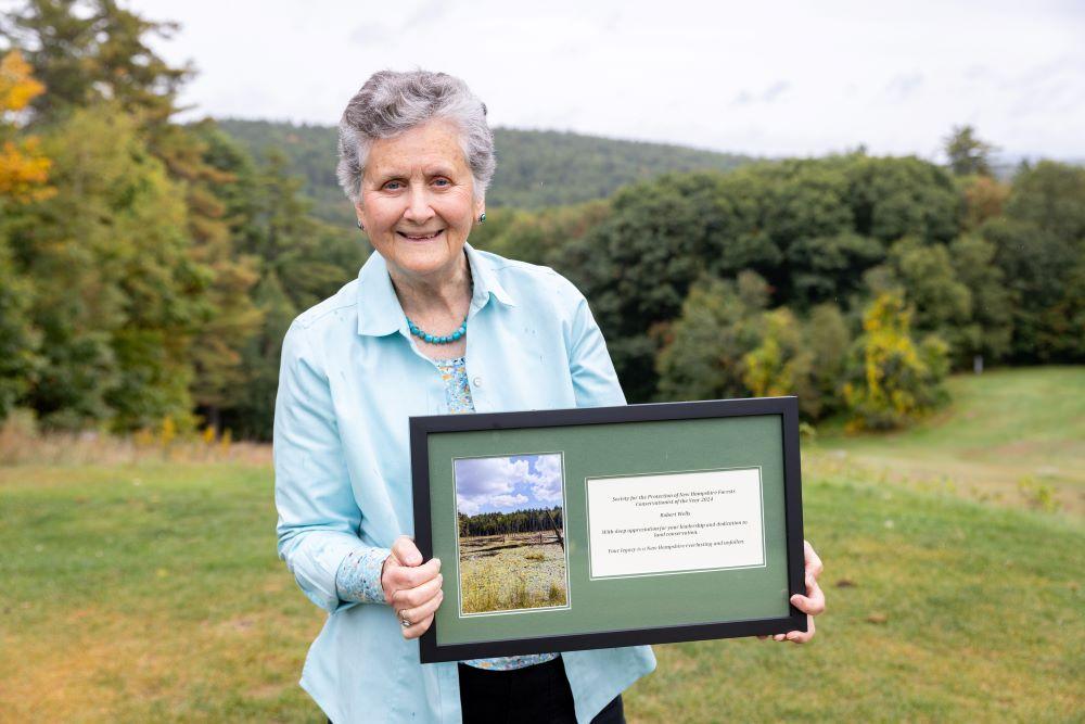 Binney Wells accepted the Conservationist of the Year Award from the Forest Society on behalf of her husband, Bob.