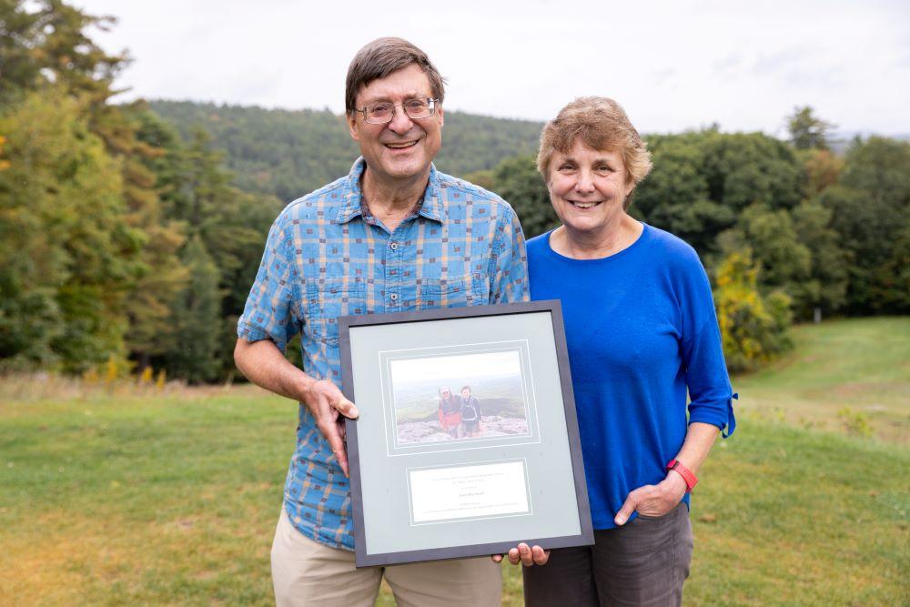 Tom and Sylvia pose together with the award outside.