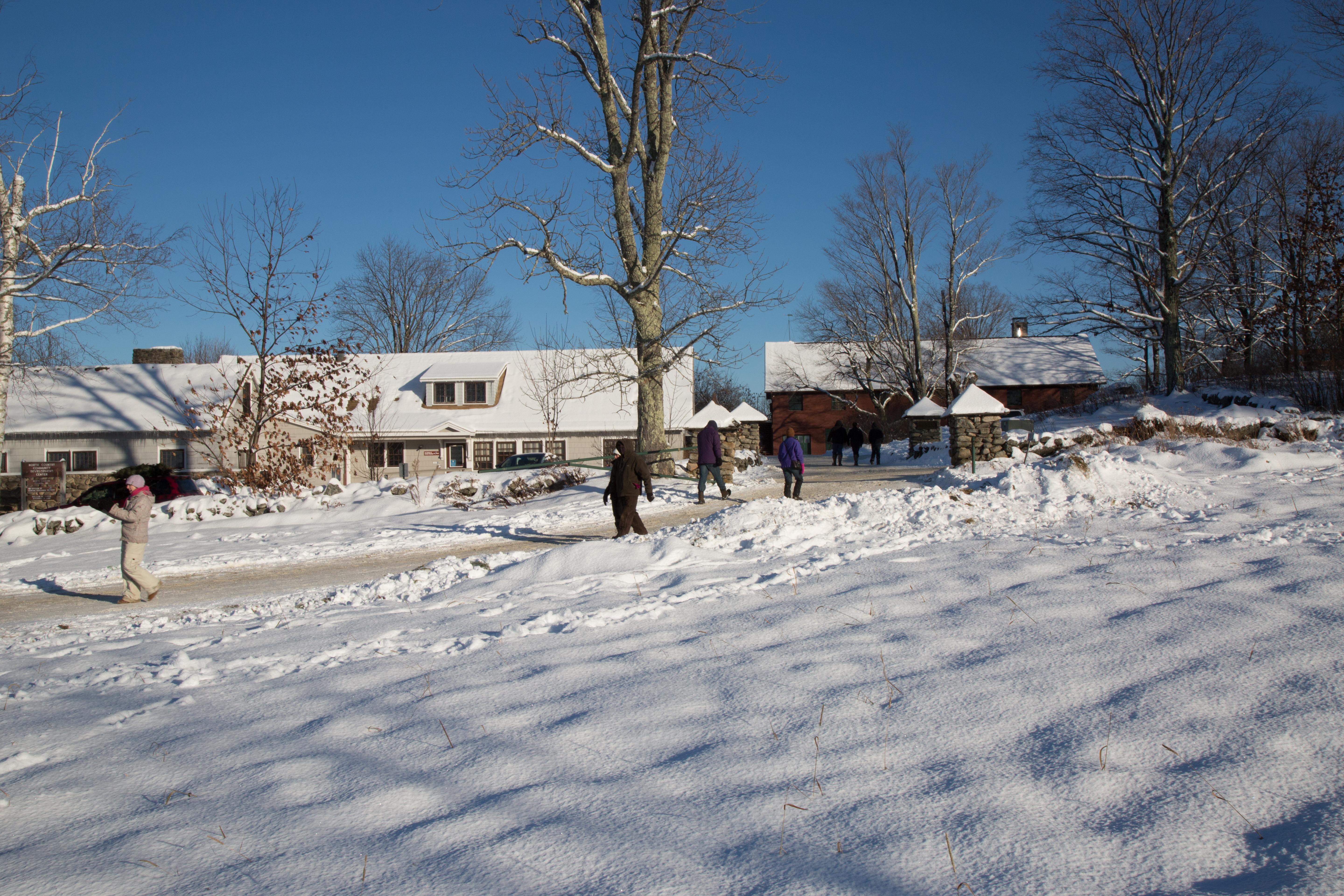 Snow covered Batchelder Cottage and Tool Building next door.