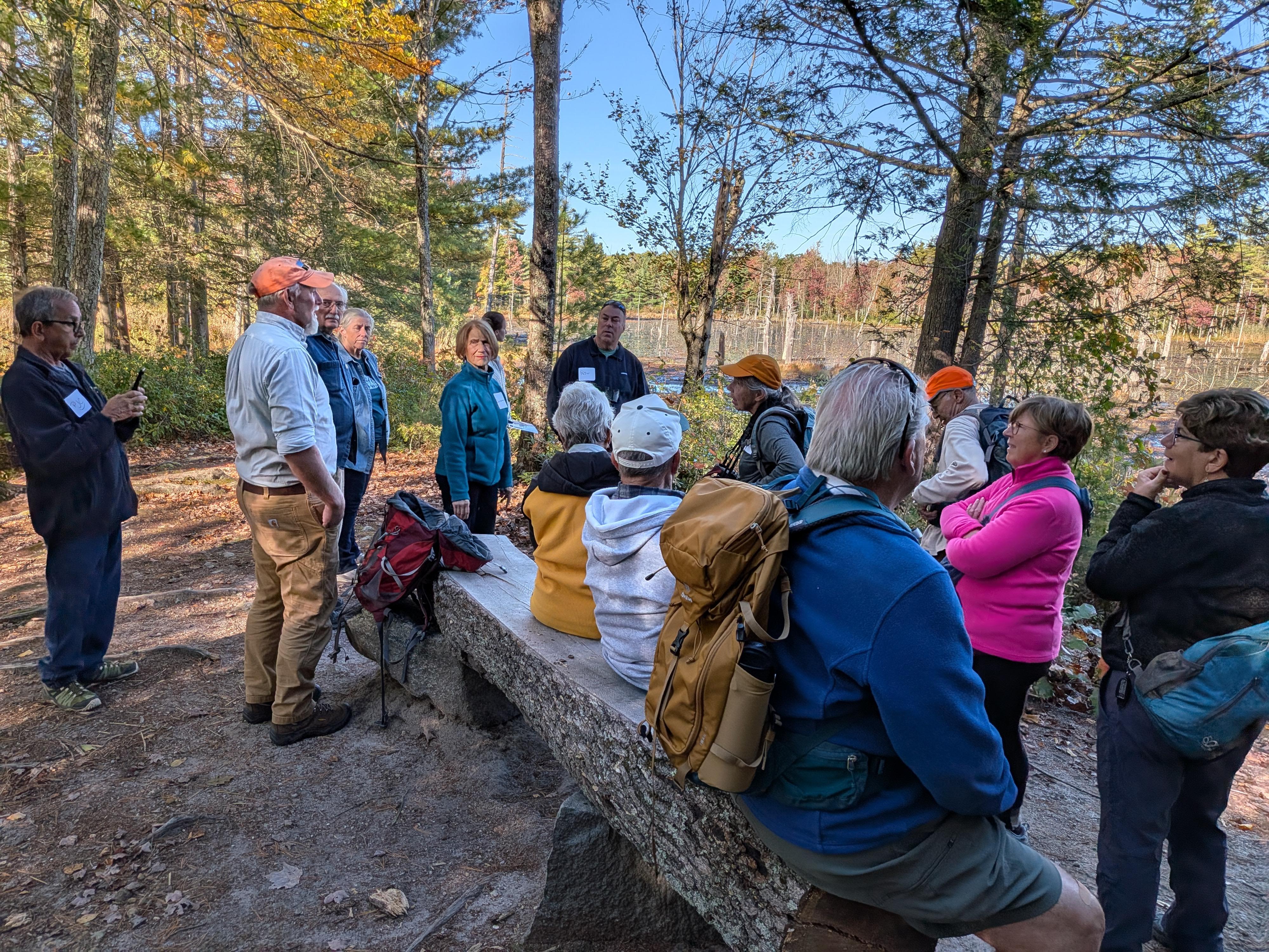 Group hike at a wetland overview at Monson Center