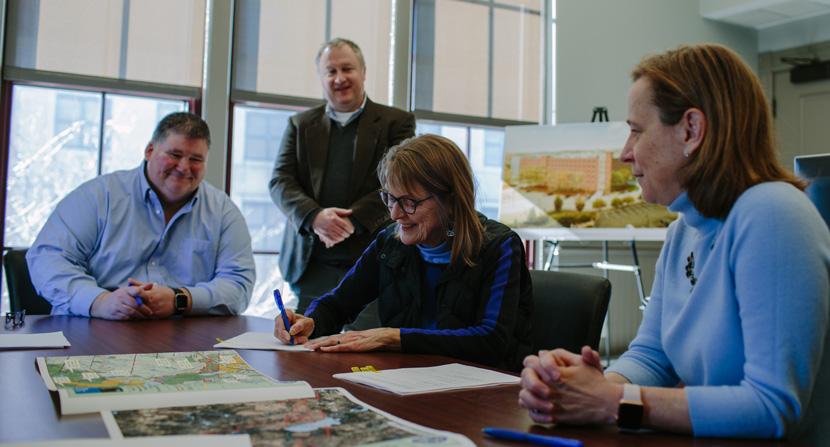 City of Manchester officials join Jane Difley, Forest Society president/forester at the closing for the Tower Hill Pond conservation easement