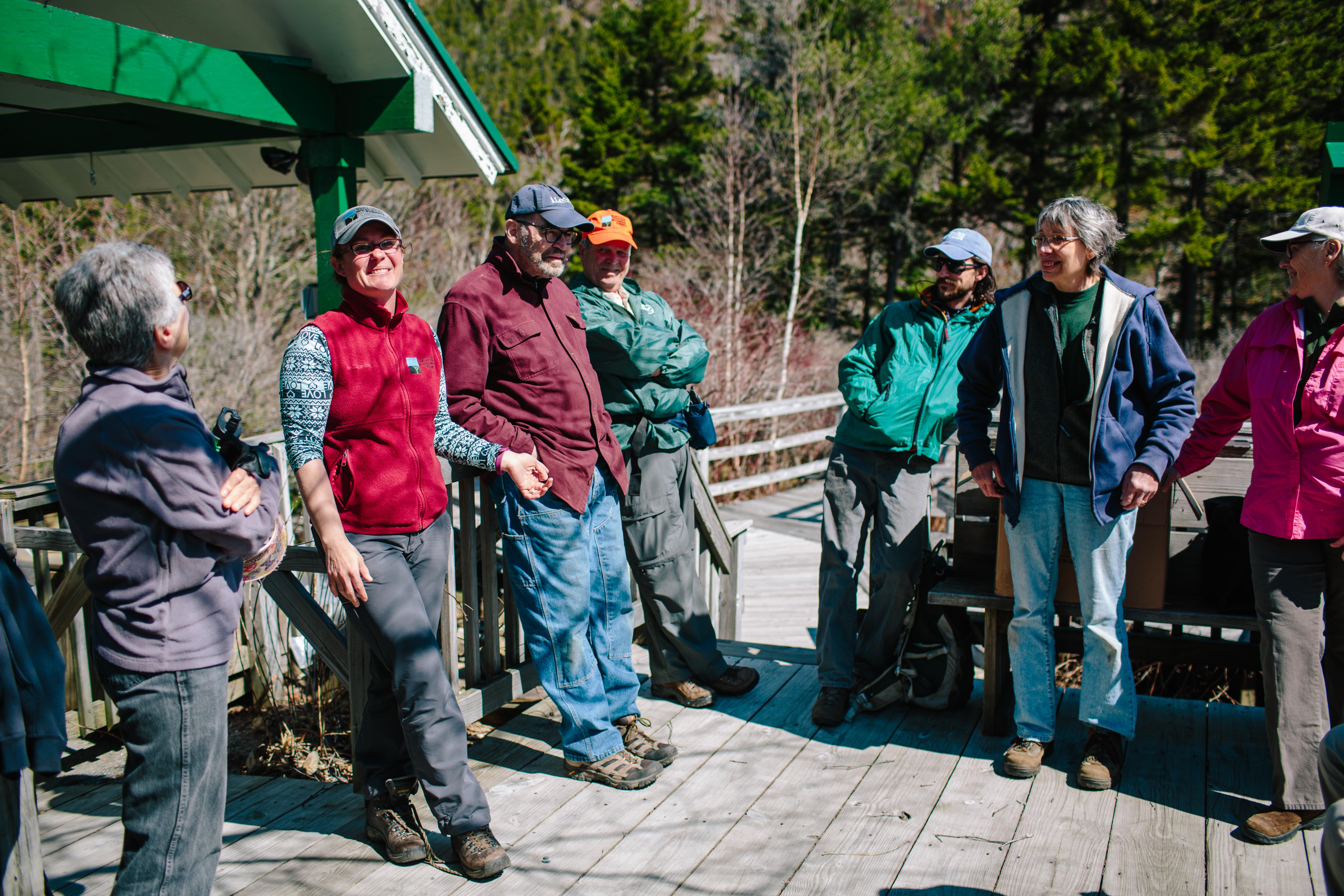 Staff member, Carrie Deegan with volunteers at Lost River, North Woodstock, NH.