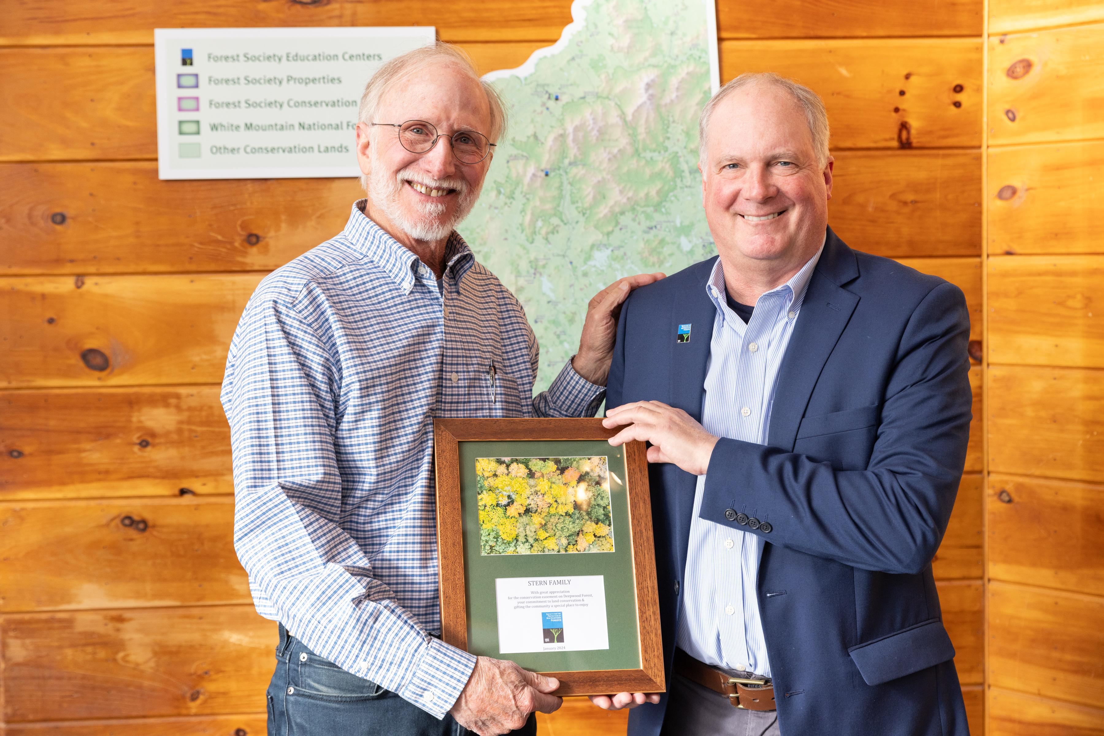 Ken Stern and Jack Savage pose at the closing at the Conservation Center.