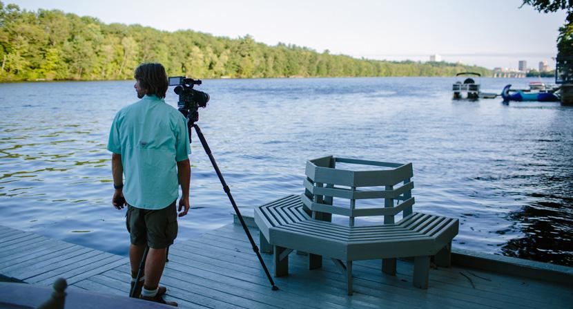 Capturing video of the Merrimack with Manchester, NH skyline in distance