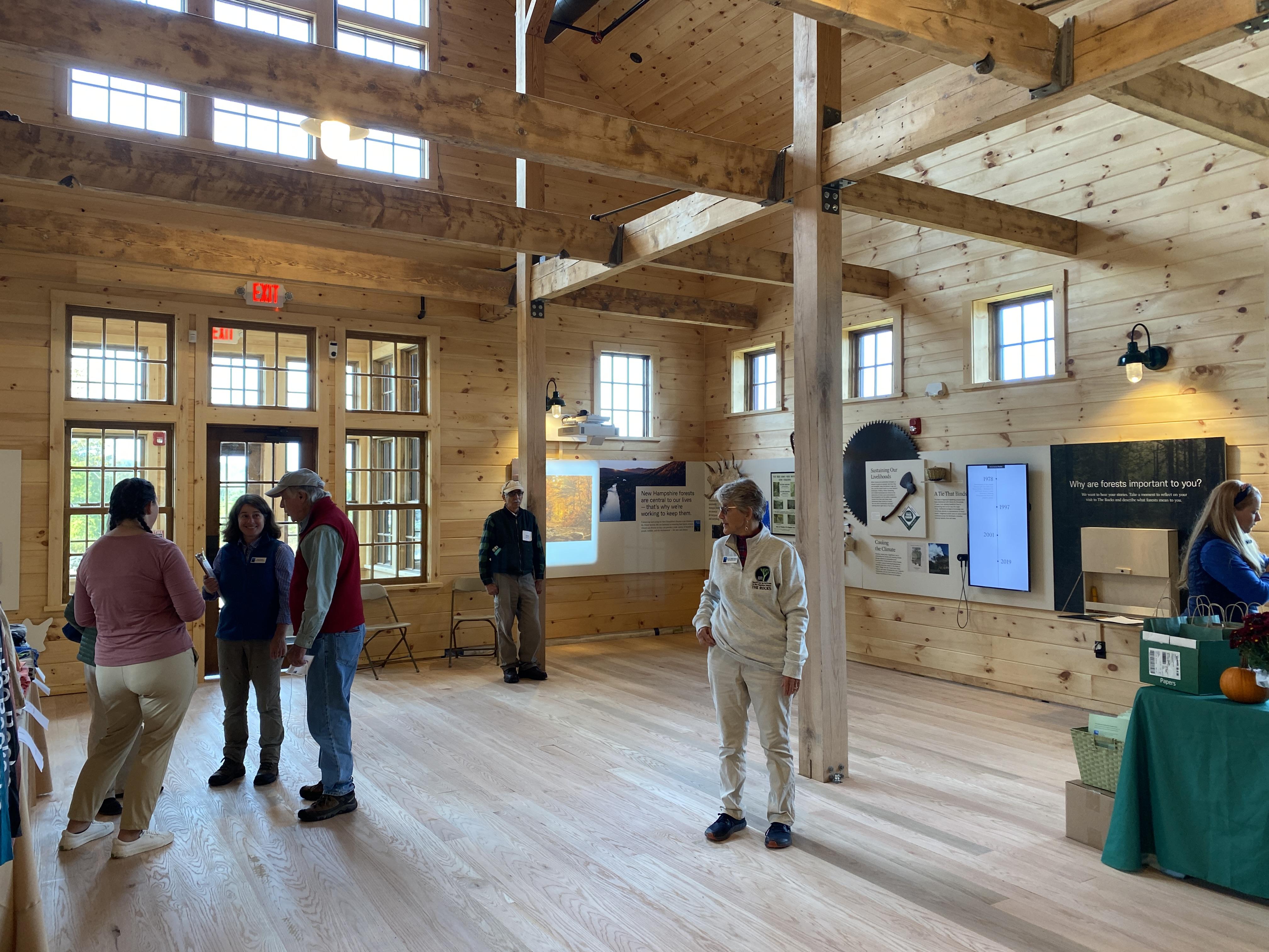 Attendees and staff mingle inside the buidling.