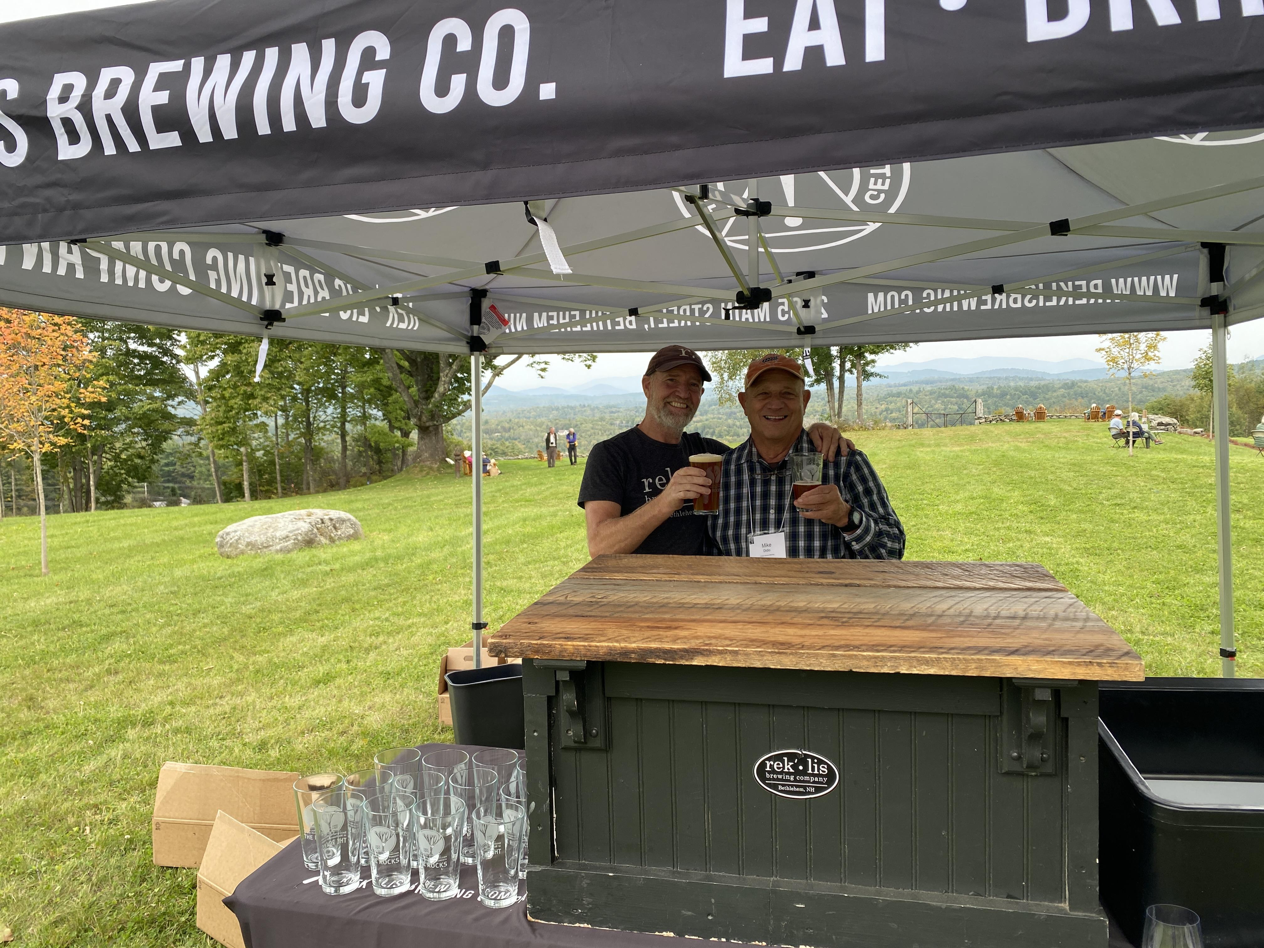 Rek-lis staff and annual meeting attendee pose together with beer.