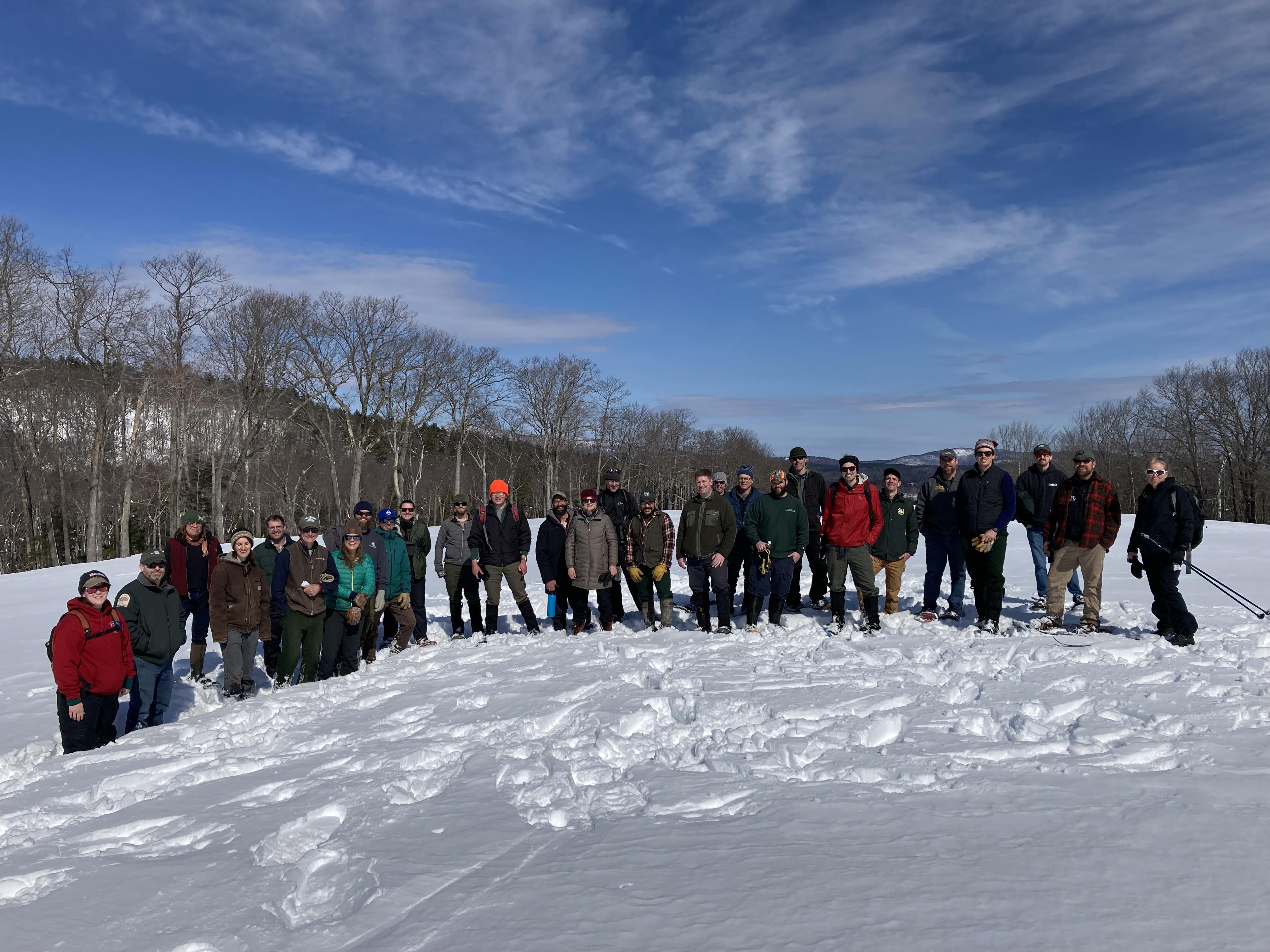 The group poses for a photo in the snow.