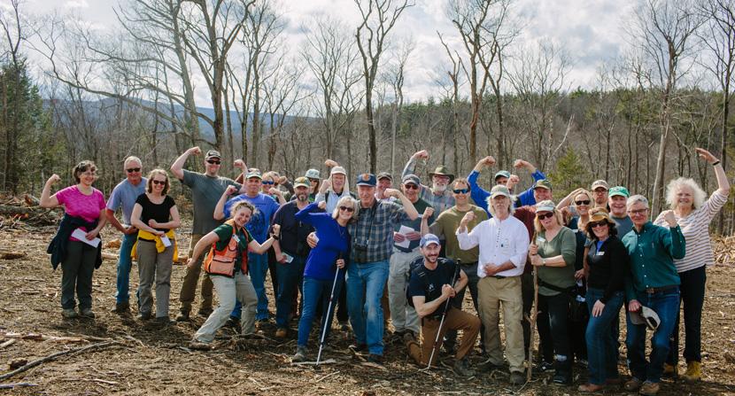 Land Steward volunteers flex their muscles during a walk on the Heald Tract in Wilton