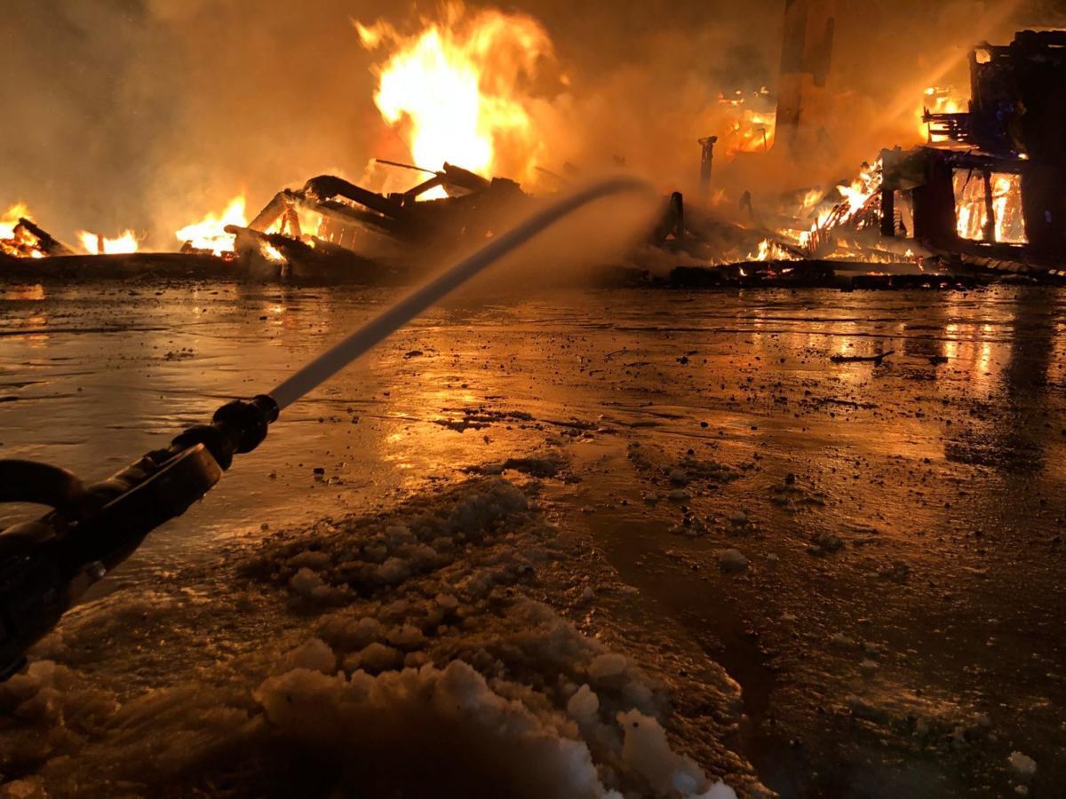 At left, firefighters battle the blaze that ravaged two of the buildings at The Rocks Estate in Bethlehem on Feb. 13.