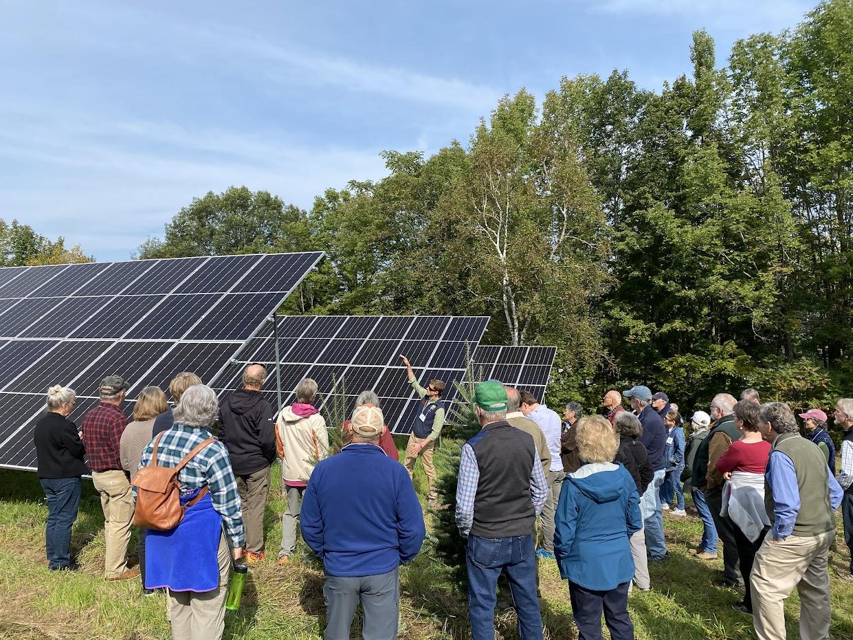 ReVision Energy VP Dan Weeks explains the technology behind the solar array to the attendees.