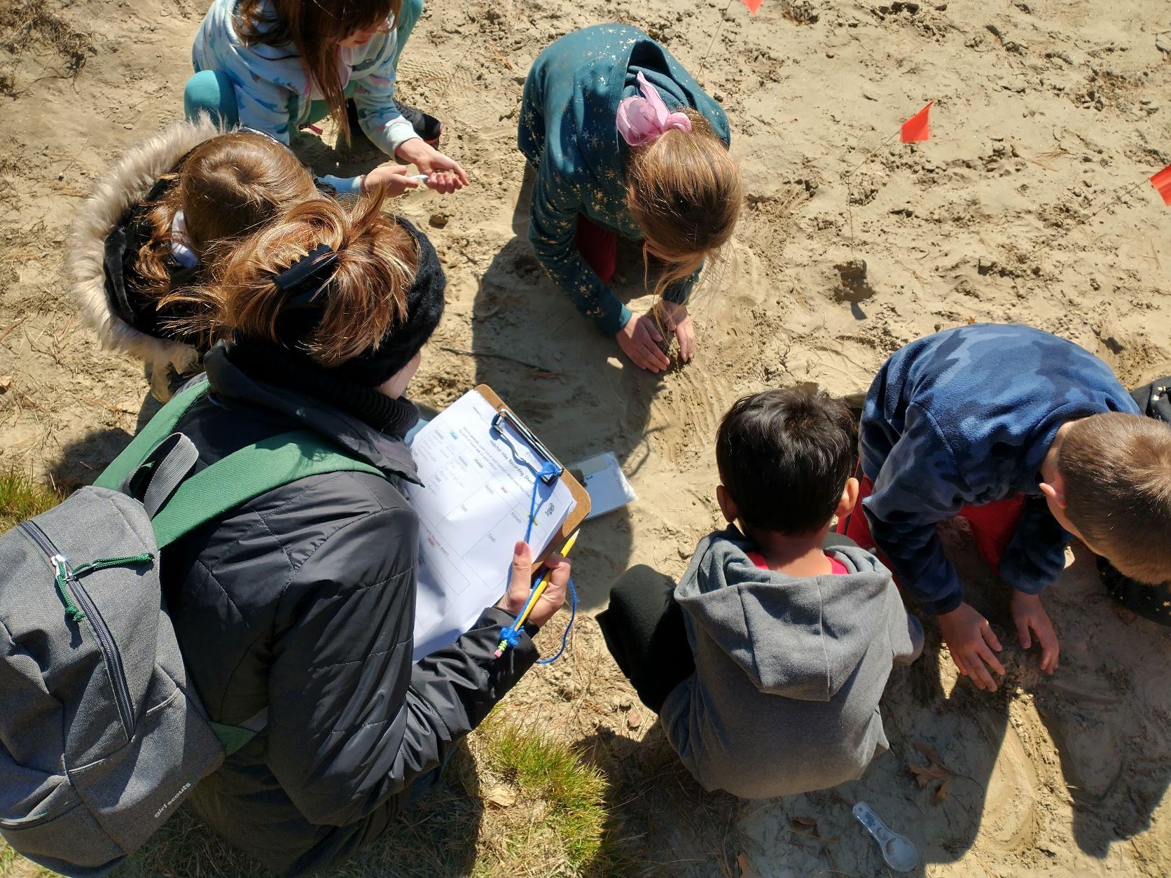 kids in sandy soil along the Merrimack River