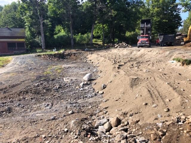Construction equipment works on moving dirt at the site of the historic Tool Building at The Rocks.