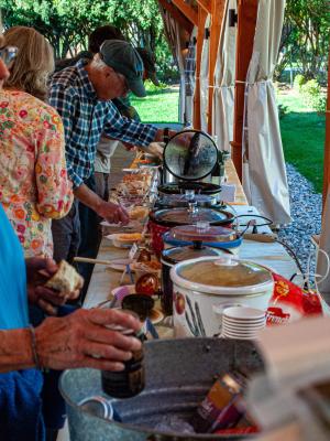 Volunteers serving themselves soup at the Fells pavilion