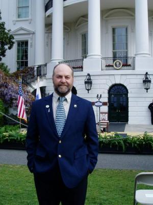 Nigel Manley stands outside the White House.