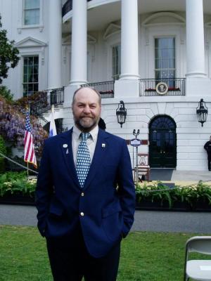 Nigel Manley stands outside the White House.