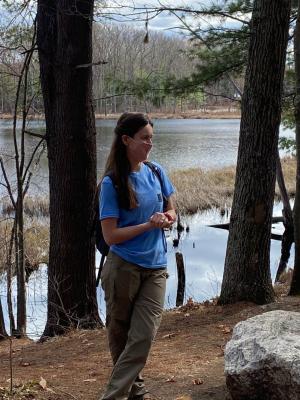 Stacie Hernandez in dappled shade along shore of Lovewell Pond