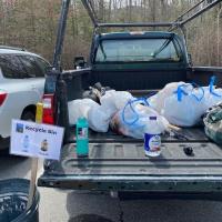 A Forest Society truck is partially full of bags of trash collected on Mount Major.