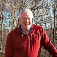 Ron Snow poses outside the Conservation Center.