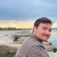 Adam Gough by the ocean.