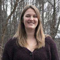 Sarah poses on the Conservation Center deck in winter.