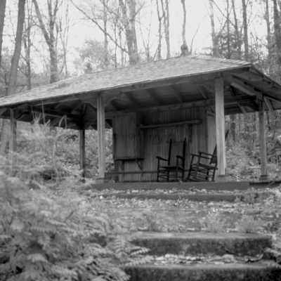 The gazebo, or bee house, in summer in black and white.