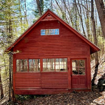 The schoolhouse is bright red.
